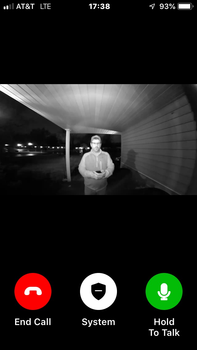 Skybell interface showing a man approaching the door during the night.